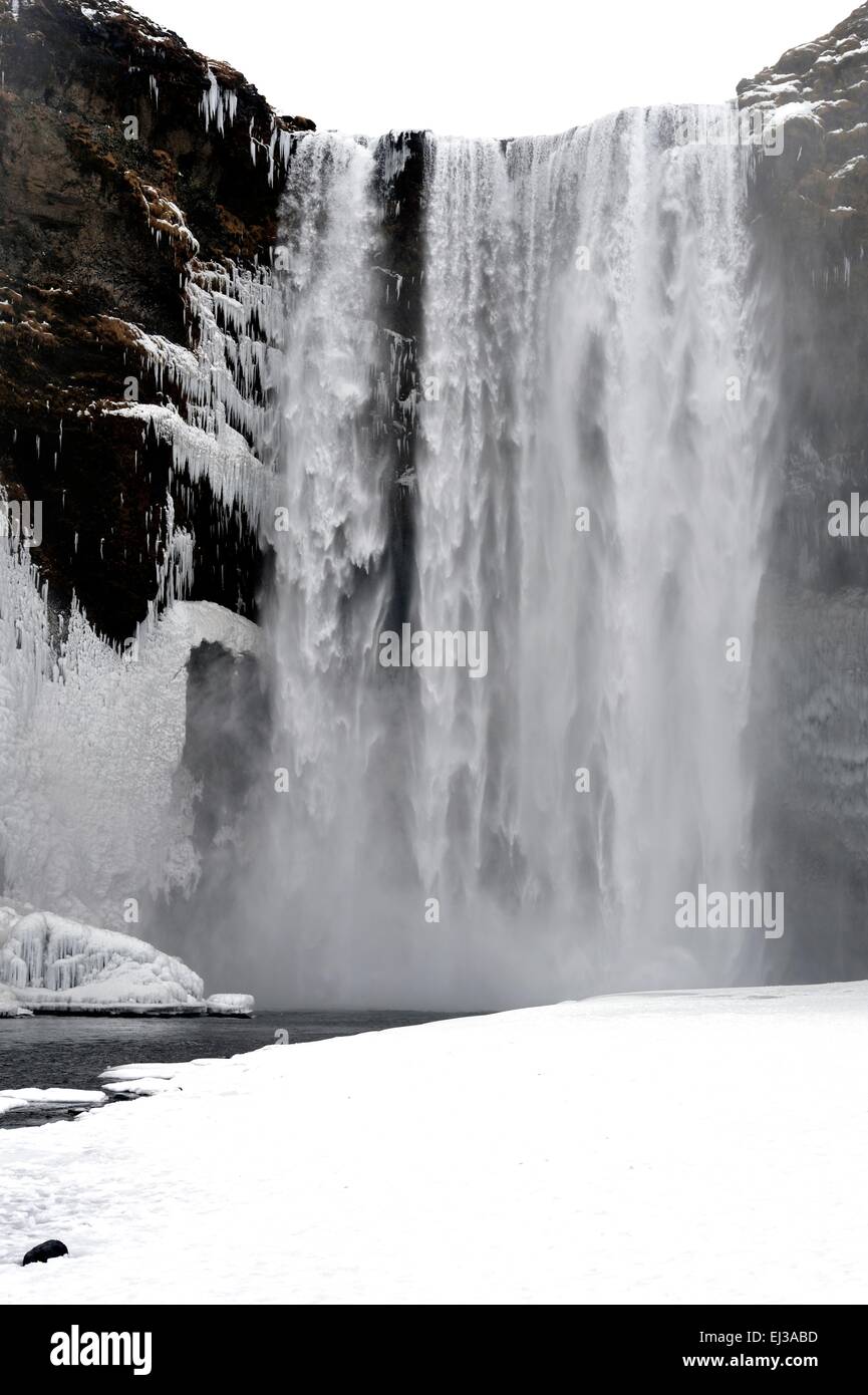 Skogafoss waterfall Iceland in snow during winter Stock Photo
