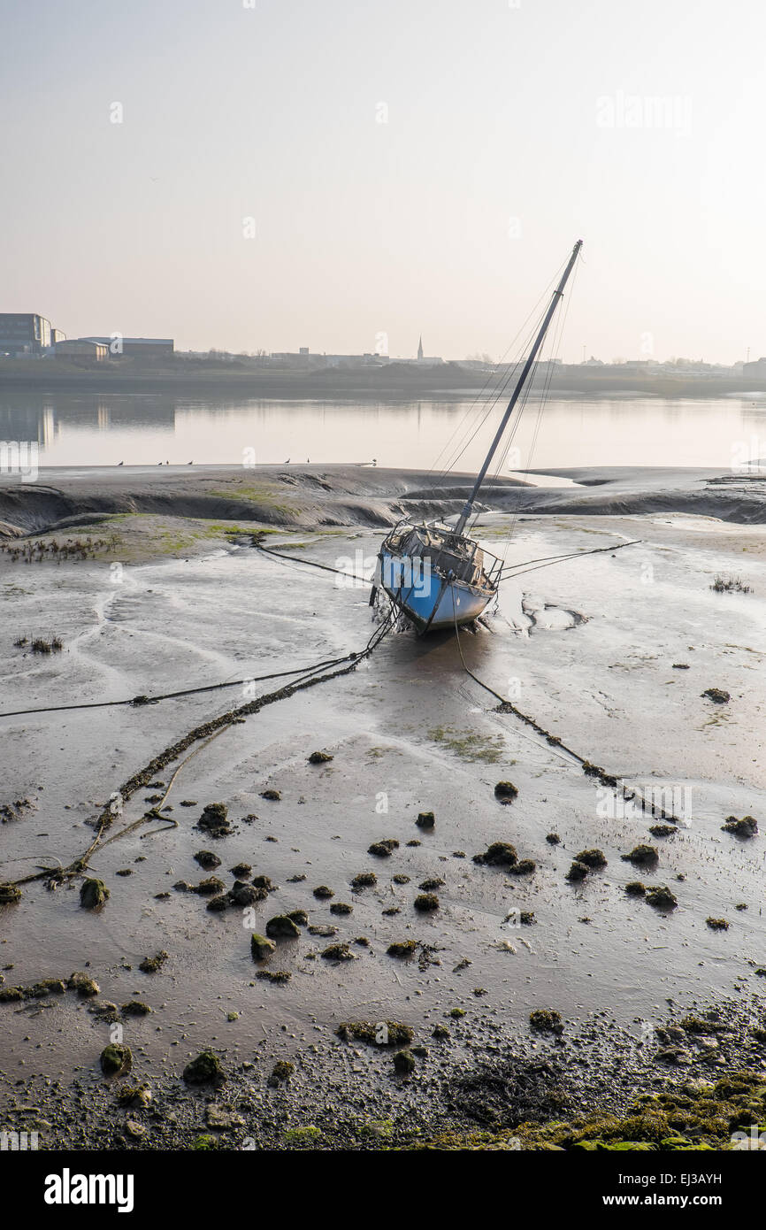 Boat at low tide, Walney Channel Cumbria Stock Photo