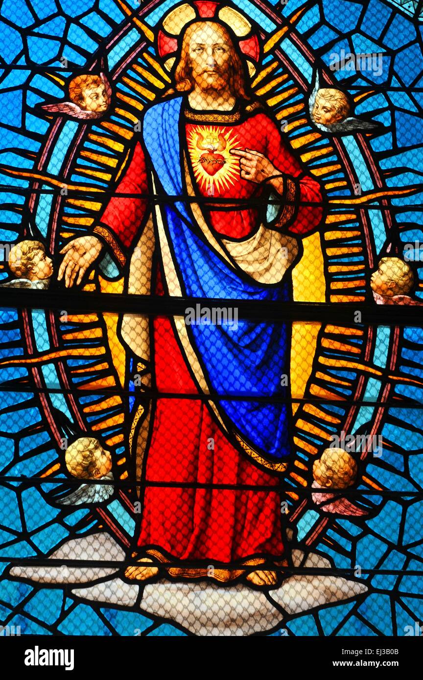 Stained glass window depicting Sacred Heart of Jesus in medieval church ...