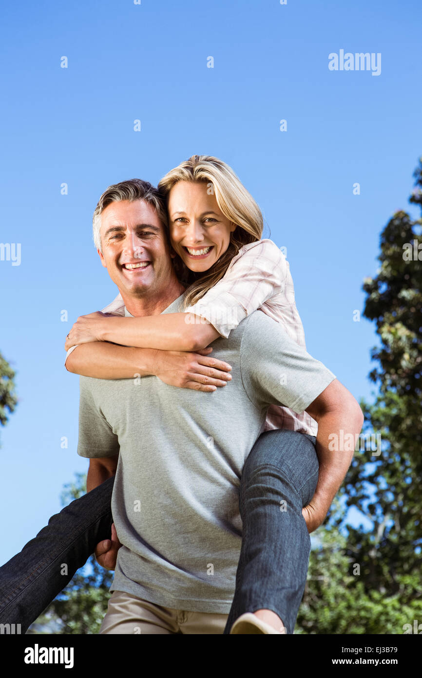 Happy couple having fun in the park Stock Photo - Alamy