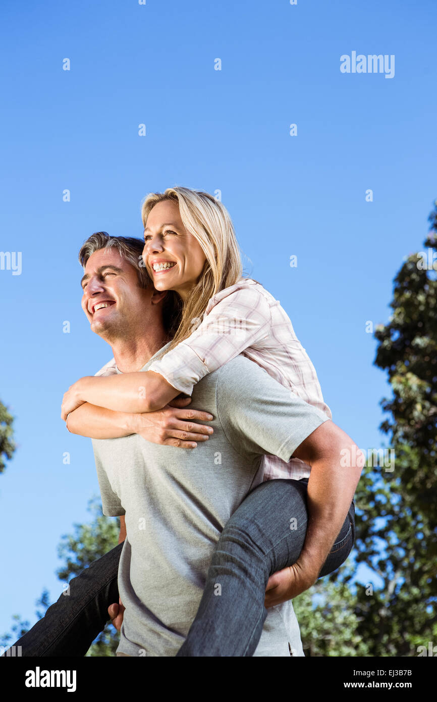 Happy couple having fun in the park Stock Photo - Alamy