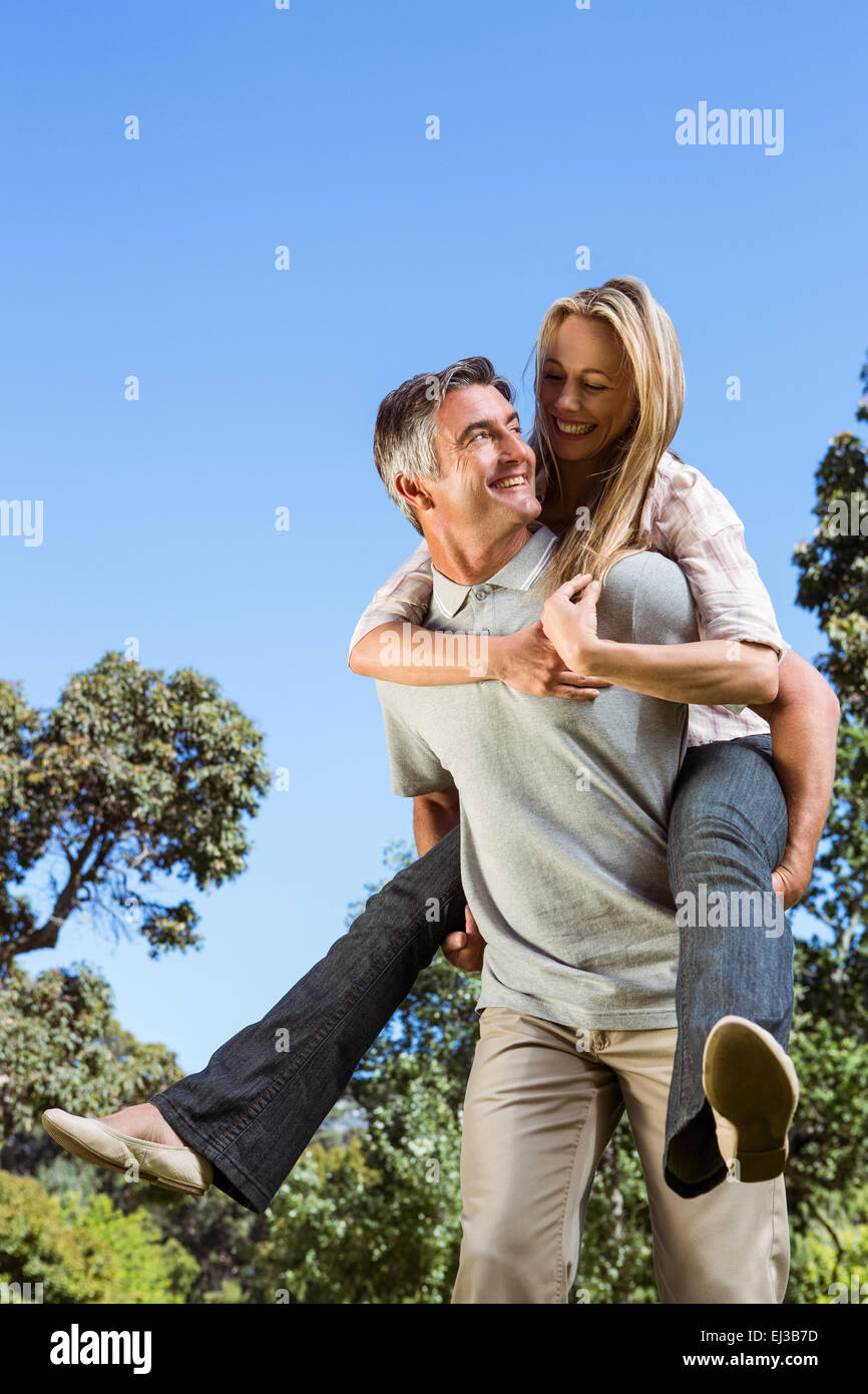 Happy couple having fun in the park Stock Photo - Alamy