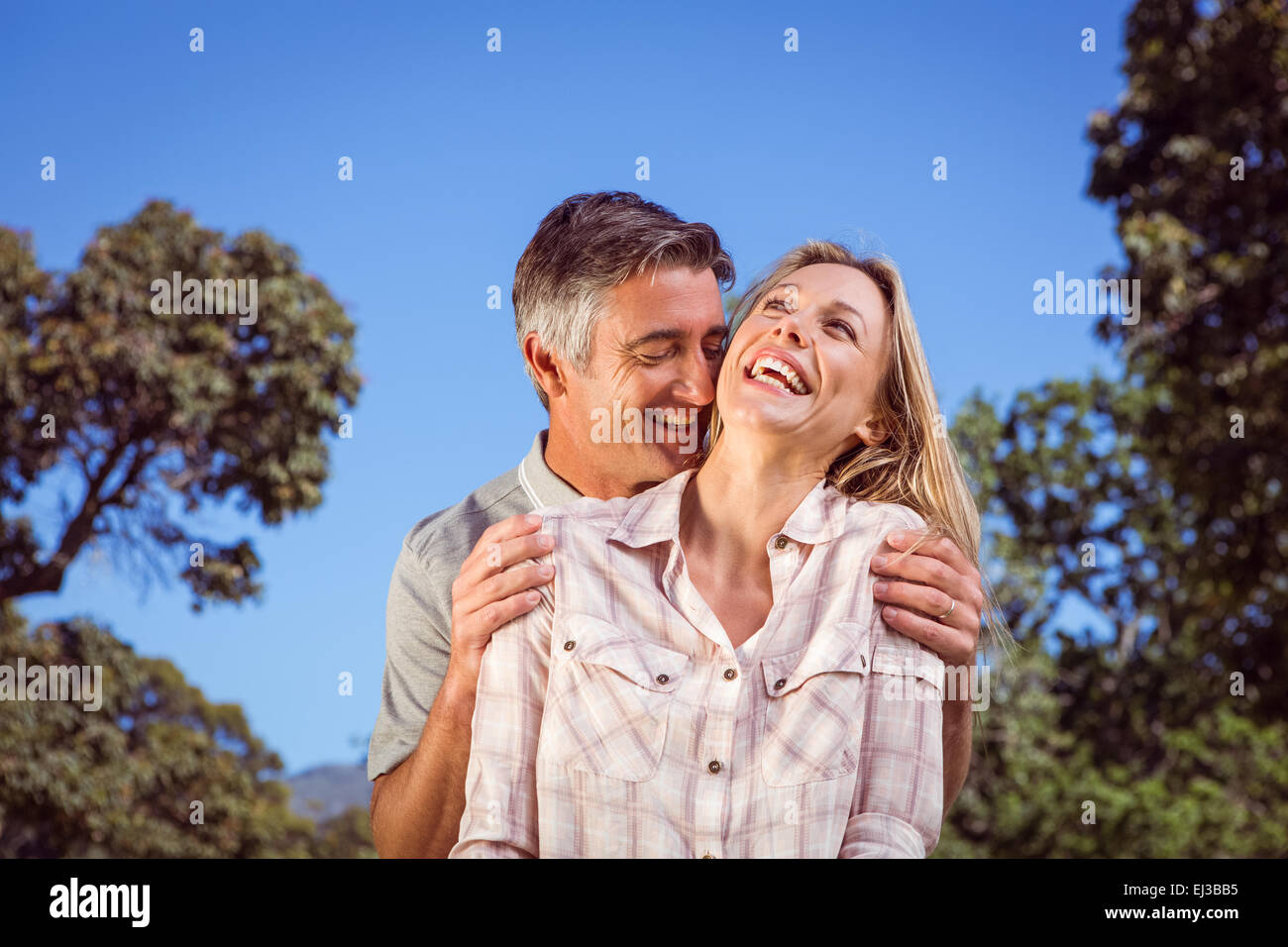 Happy couple having fun in the park Stock Photo - Alamy
