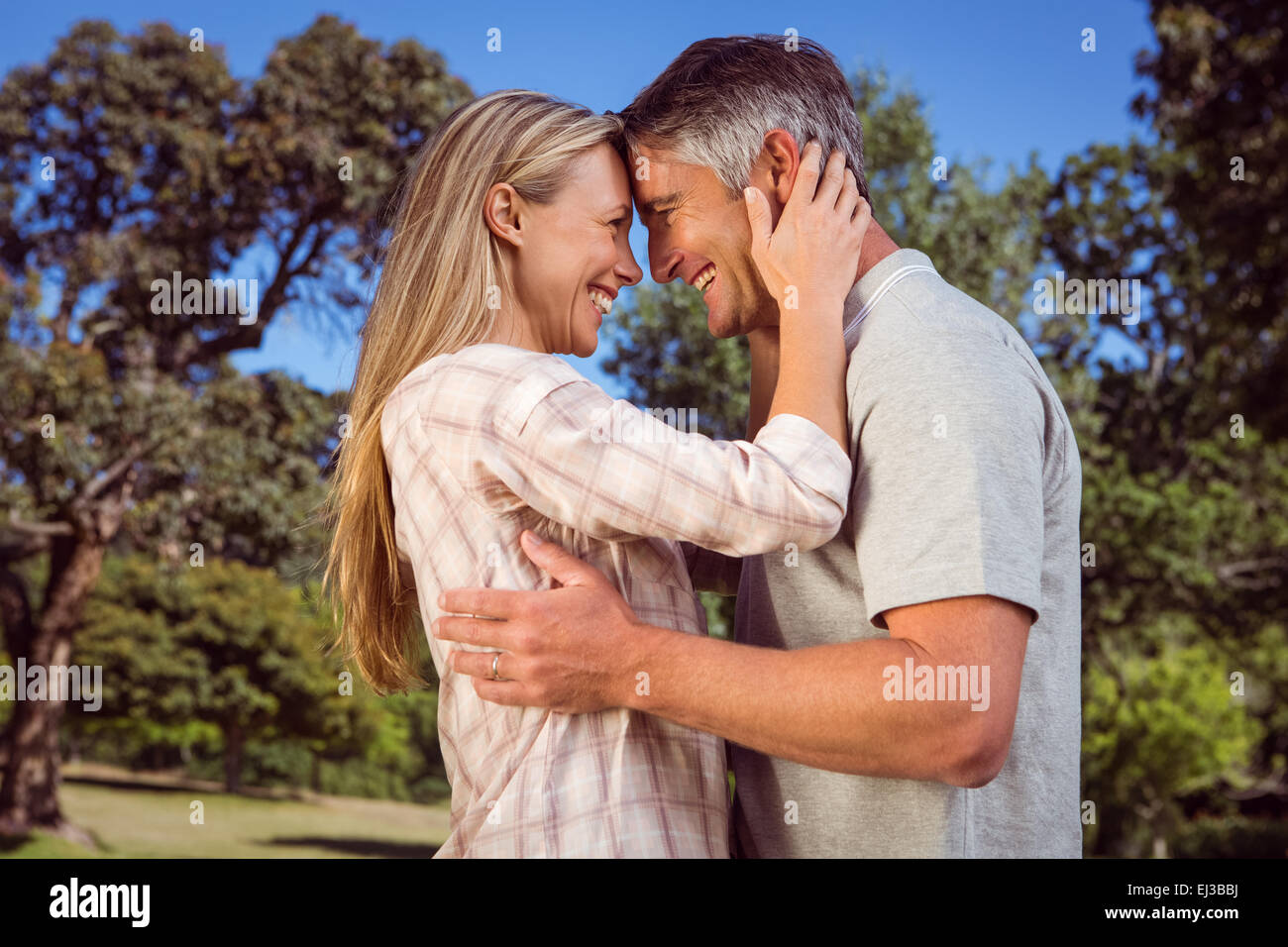Happy couple in the park Stock Photo - Alamy