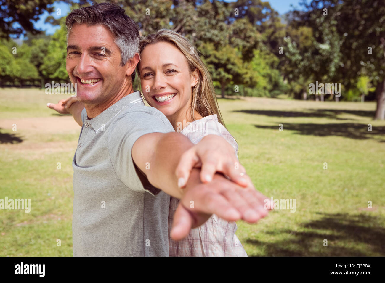Happy couple in the park Stock Photo - Alamy