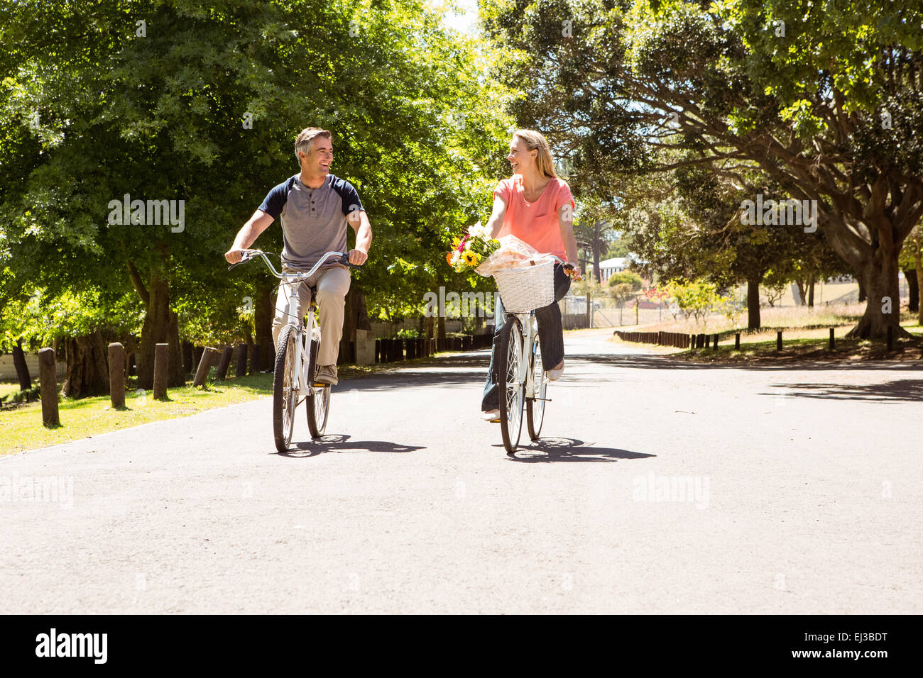 Happy couple on a bike ride Stock Photo