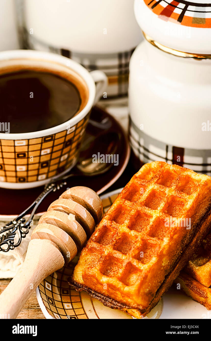 Belgian waffles with coffee and honey Stock Photo Alamy