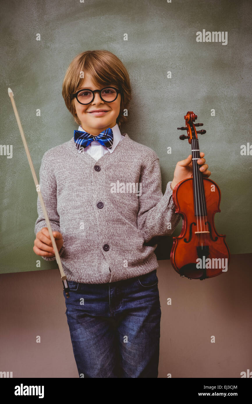 Portrait of cute little boy holding violin Stock Photo - Alamy
