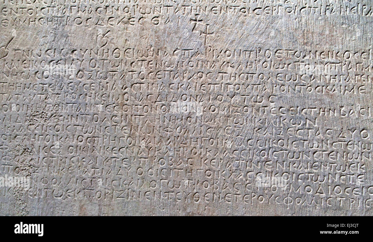 Ancient greek text carved on marble, close-up Stock Photo