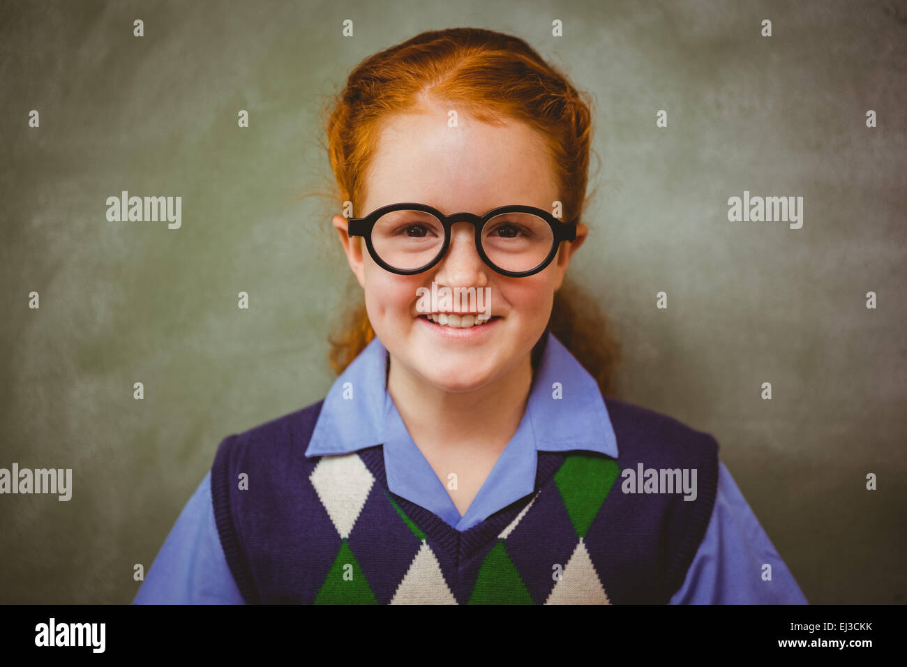 Portrait of cute little girl smiling in classroom Stock Photo - Alamy