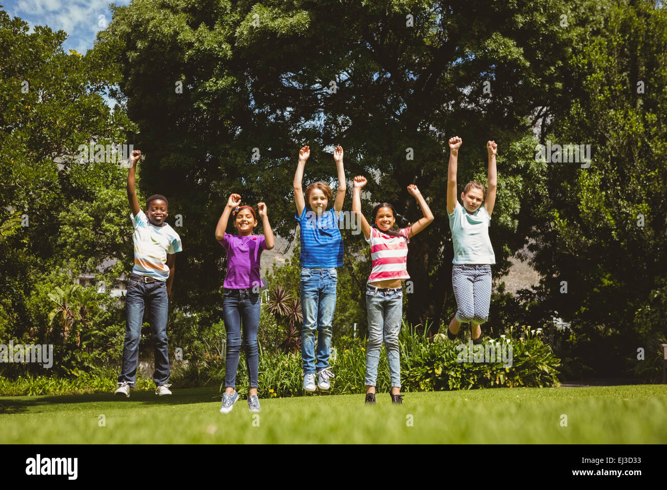 Children jumping at park Stock Photo - Alamy