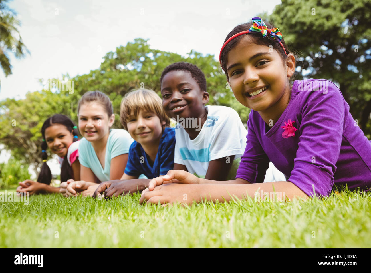 Children lying grass hi-res stock photography and images - Alamy