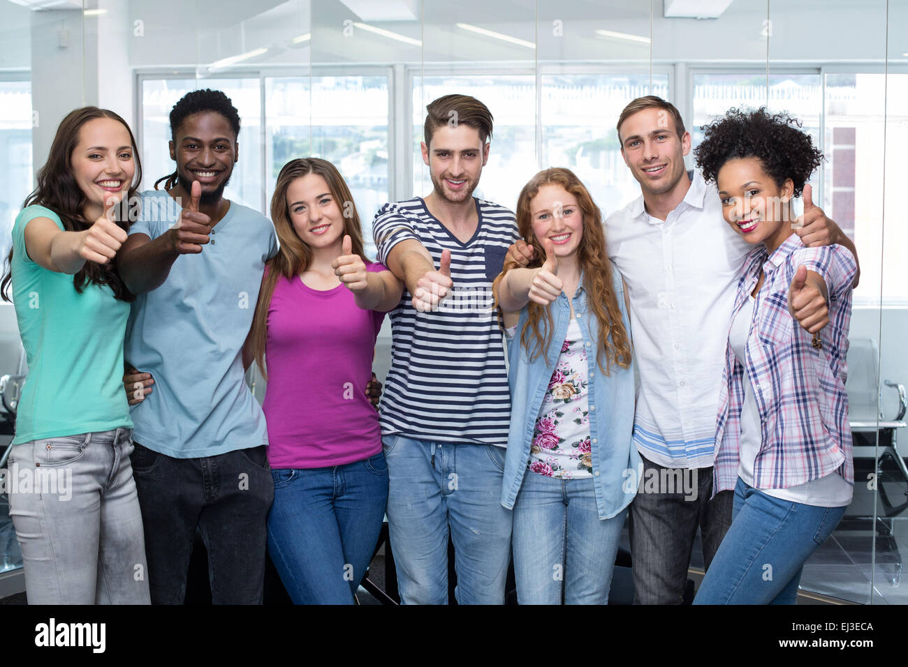 College students gesturing thumbs up Stock Photo - Alamy