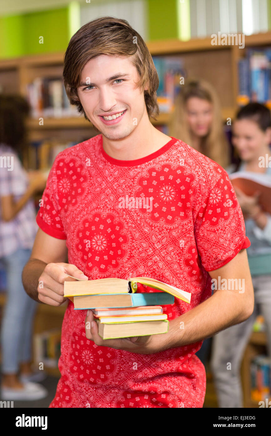 College student holding books library hires stock photography and