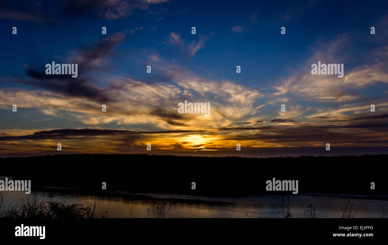 Dark Sunset Over the River Stock Photo - Alamy