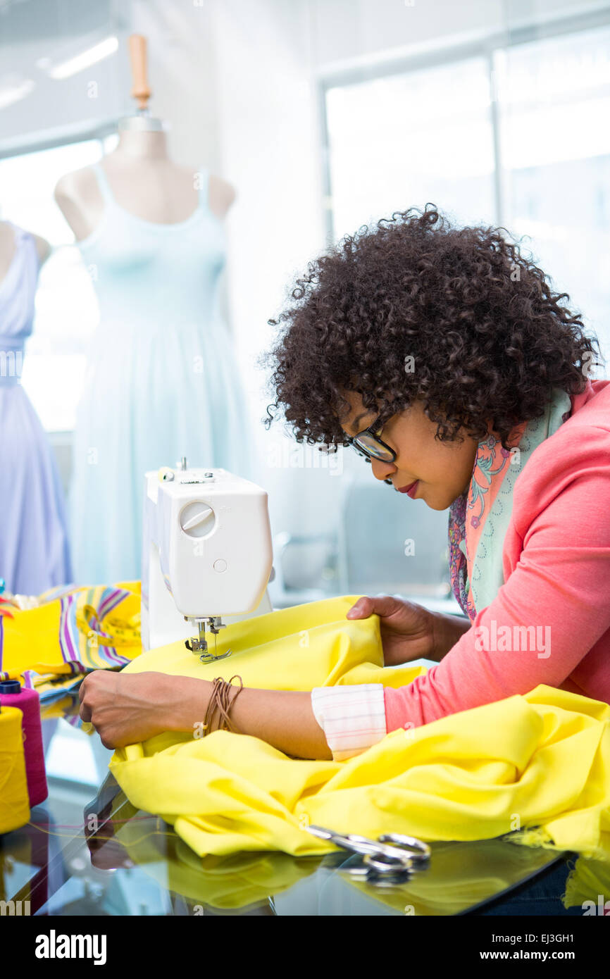 Fashion designer using sewing machine Stock Photo Alamy