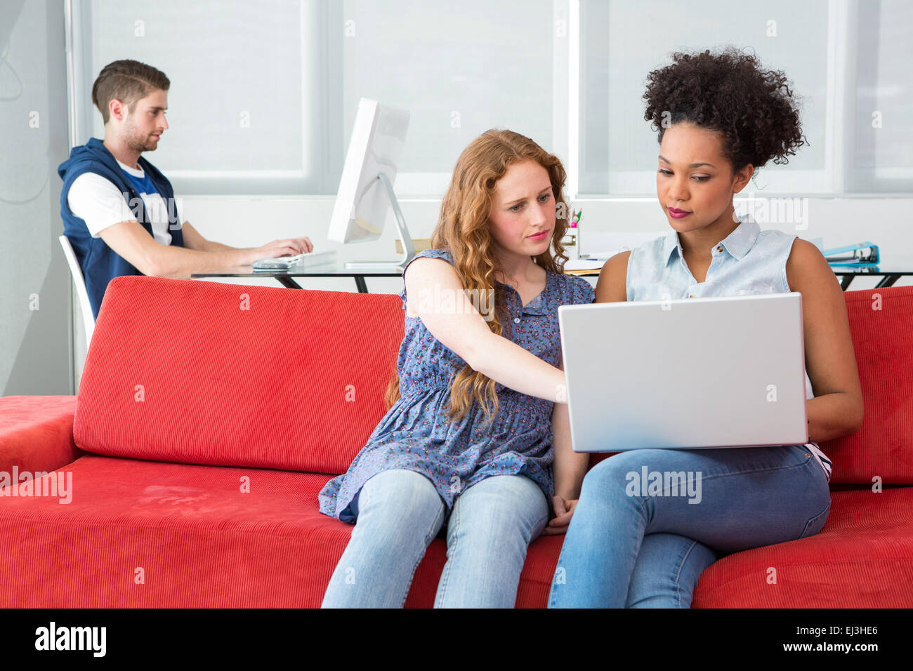 Team Using Computers Creative team using computers Stock Photo - Alamy