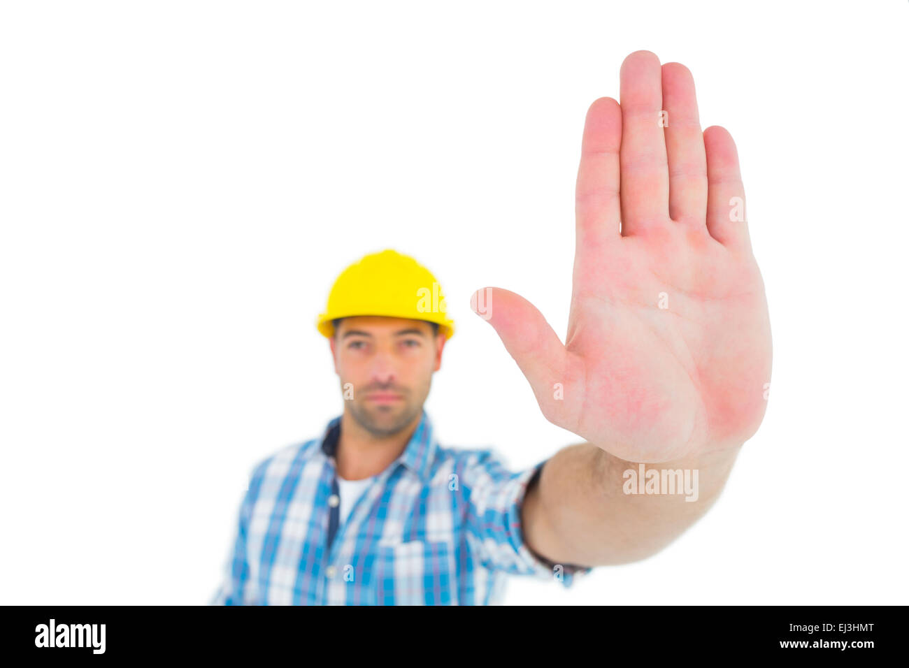 Confident manual worker gesturing stop sign Stock Photo