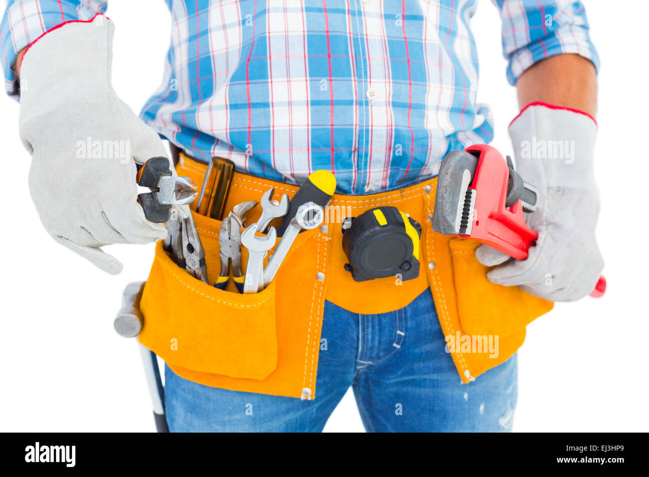 Midsection of handyman holding hand tools Stock Photo