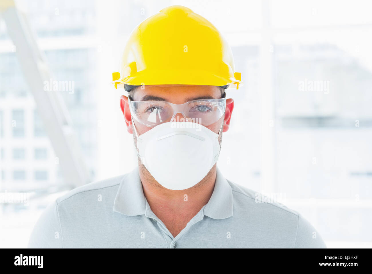 Confident handyman wearing protective workwear Stock Photo