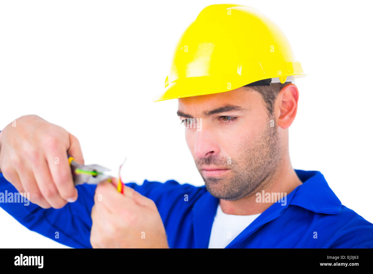 Electrician wearing hard hat while cutting wire Stock Photo Alamy