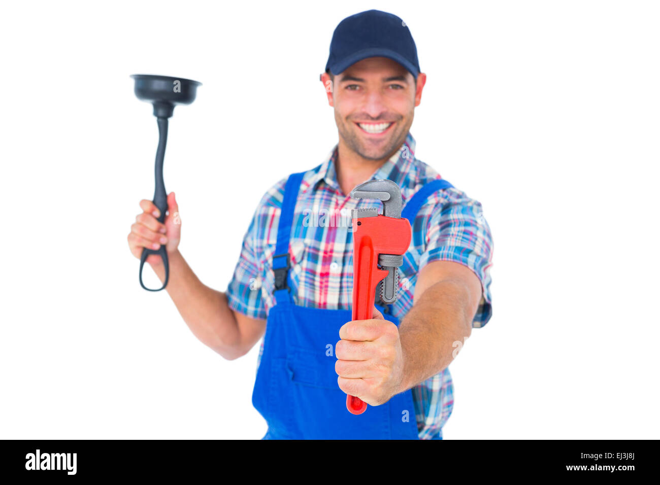 Handyman holding plunger and wrench on white background Stock Photo