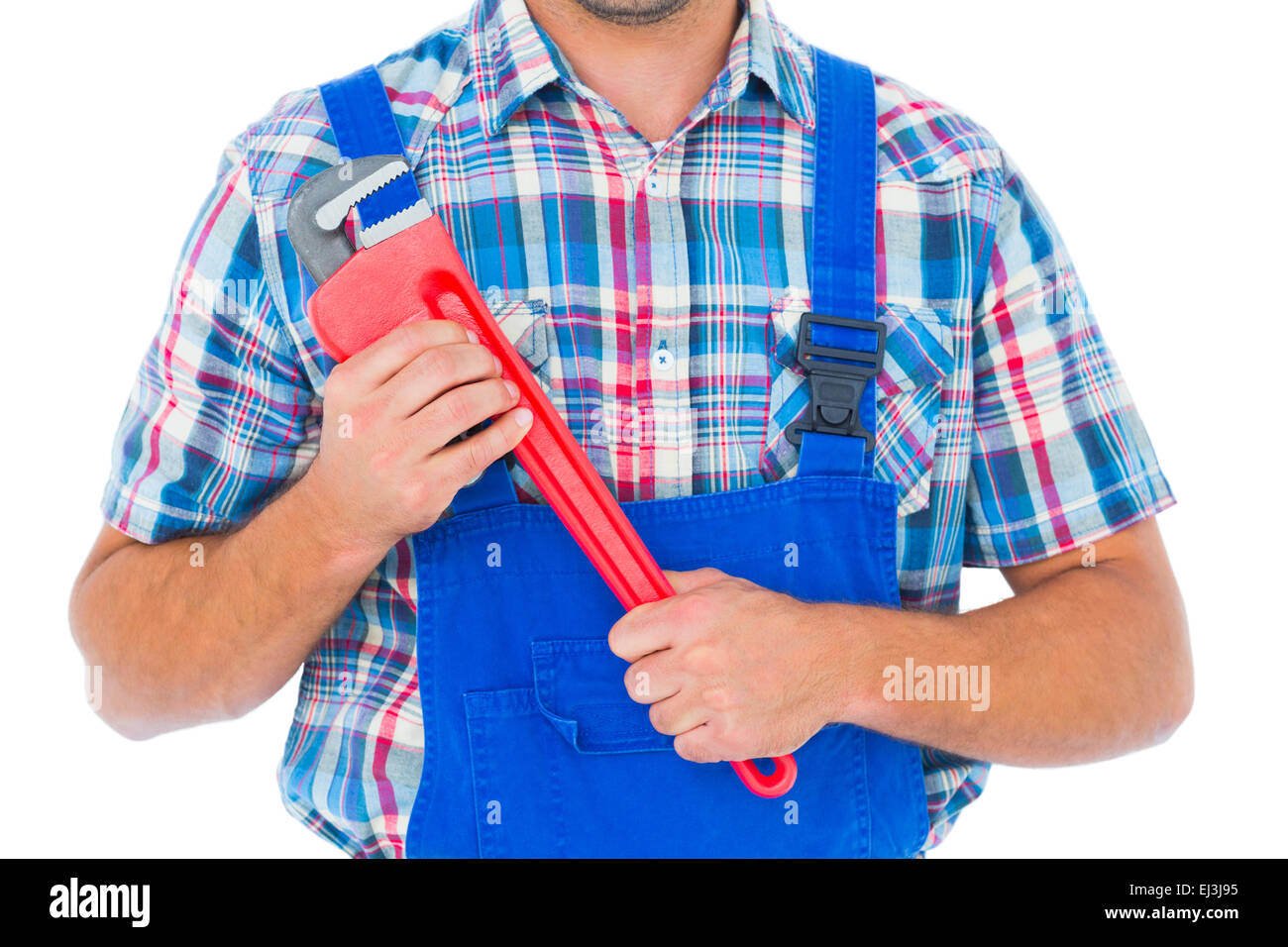 Cropped image of repairman holding monkey wrench Stock Photo