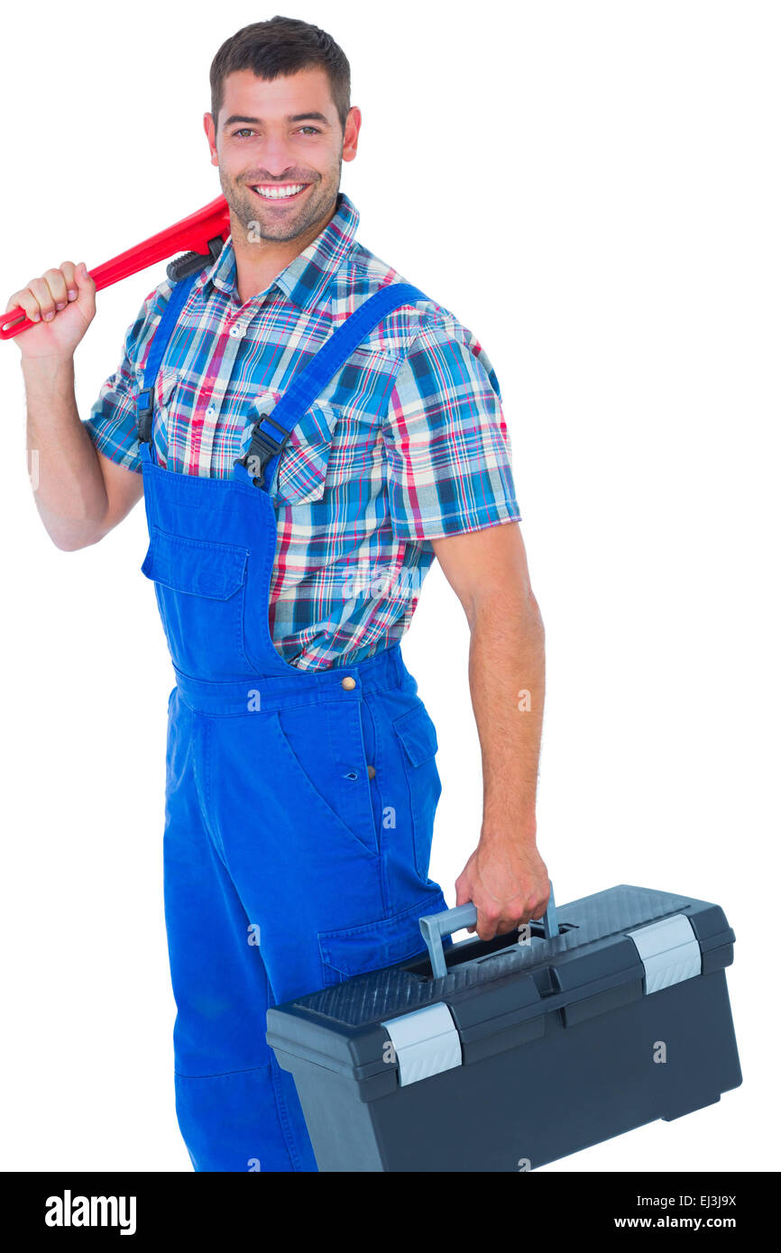 Happy repairman with toolbox and monkey wrench Stock Photo