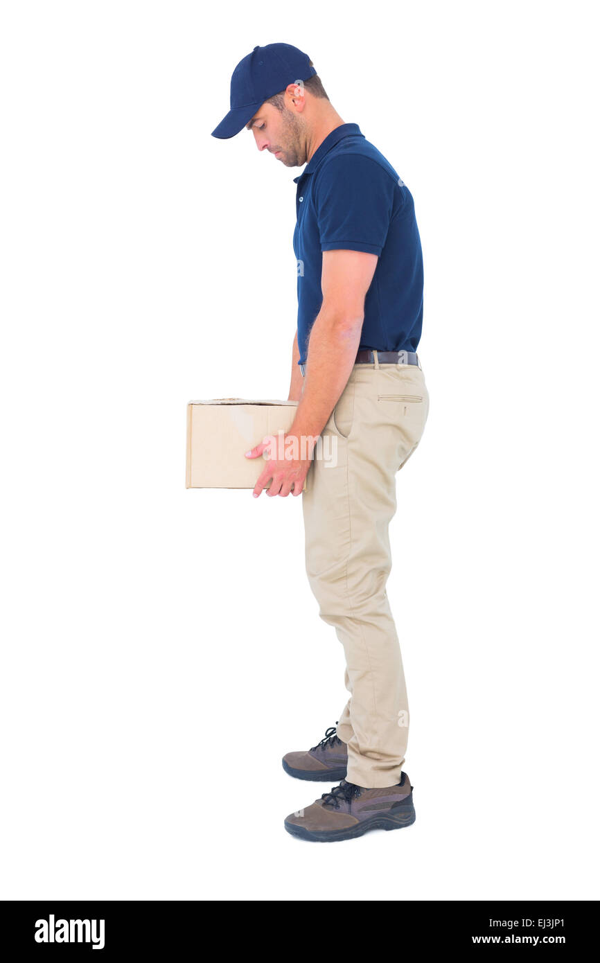 Delivery man carrying heavy package on white background Stock Photo Alamy