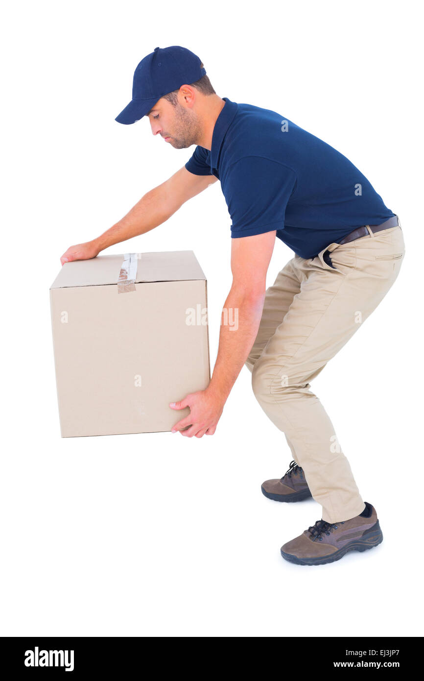 Courier man picking up cardboard box Stock Photo Alamy