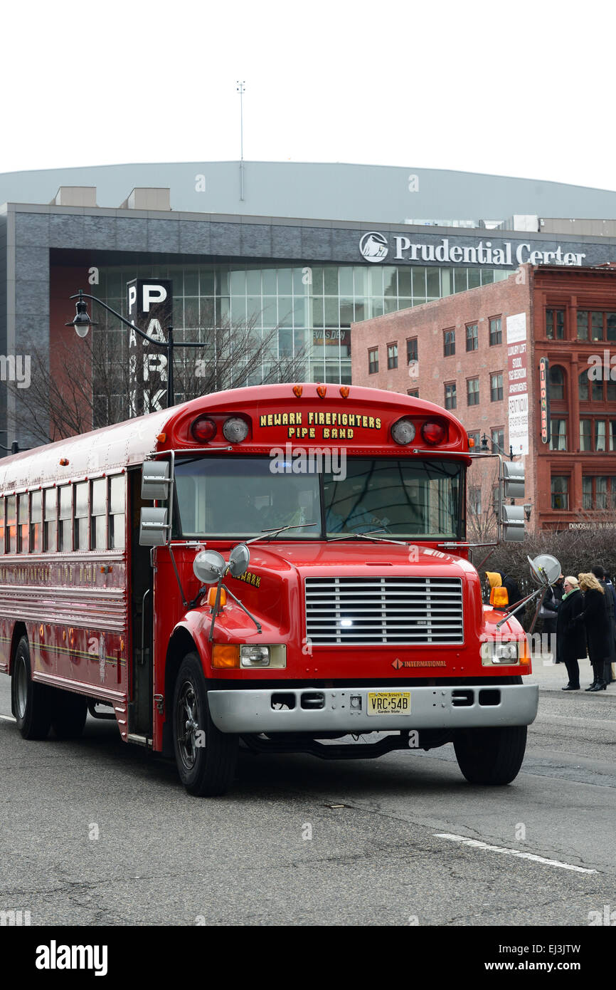Newark firefighters pipe band's bus during the 2013 St. Patrick's Day parade. Newark, New Jersey. USA Stock Photo