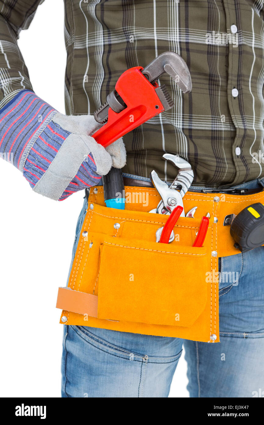 Handyman holding hand tool Stock Photo