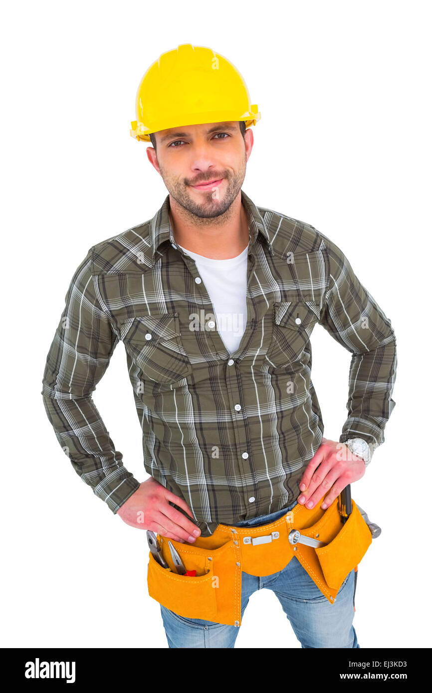 Handyman wearing tool belt with hands on hips Stock Photo Alamy