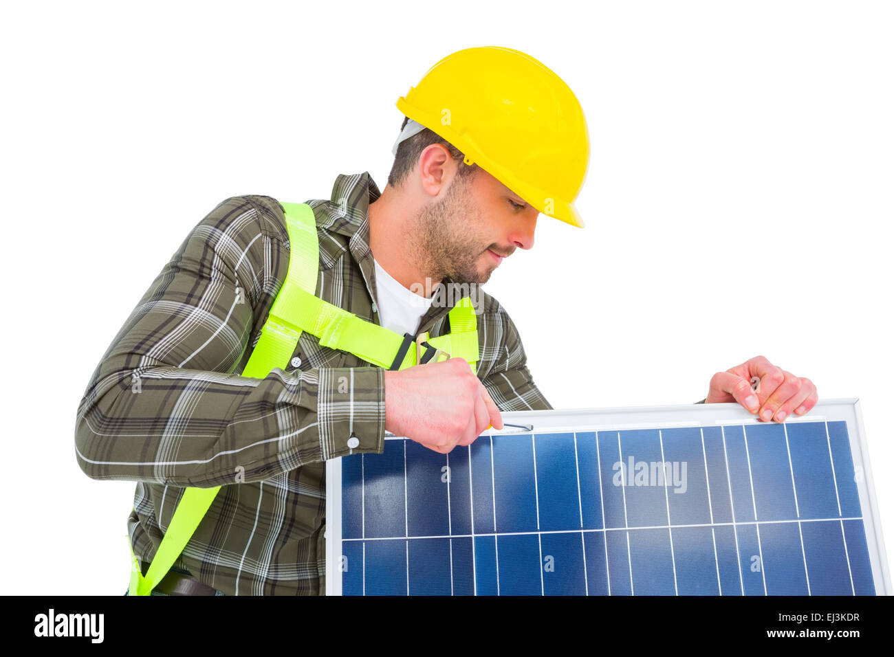 Worker tightening solar panel Stock Photo