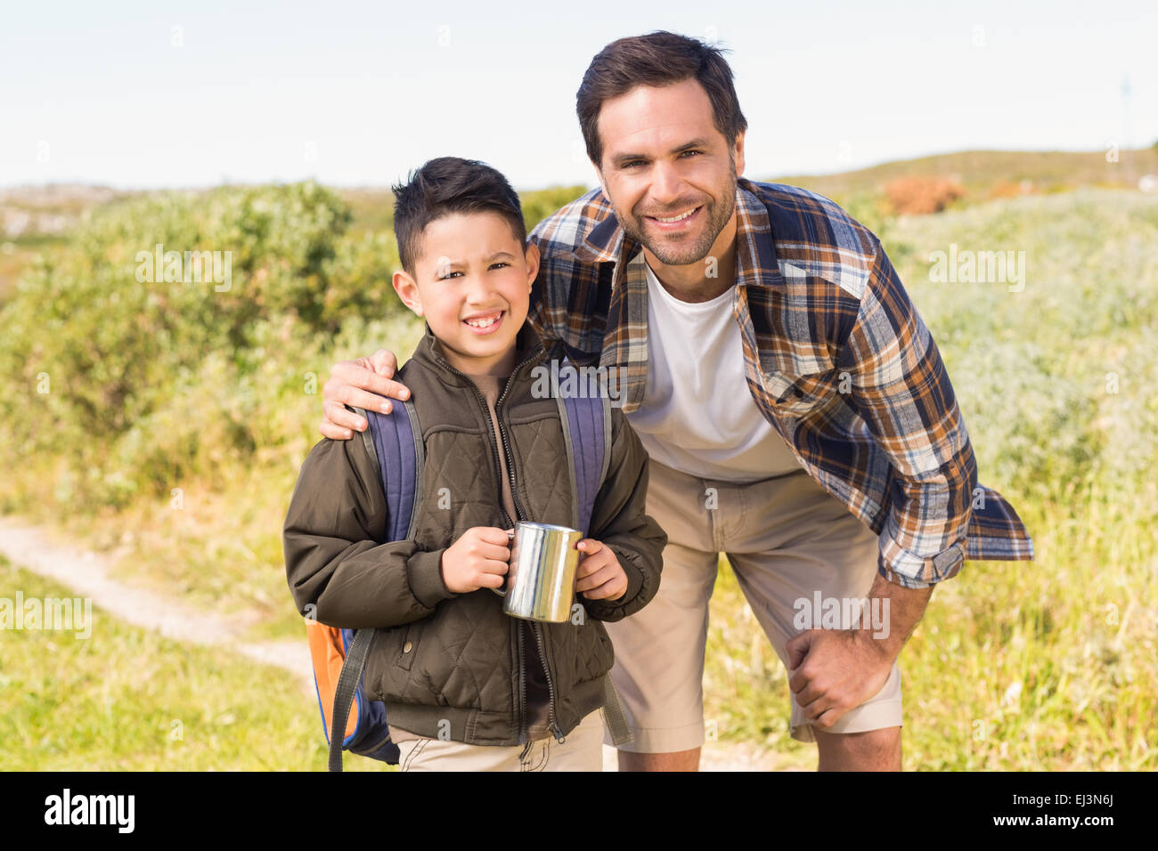 Father and son hiking in the mountains Stock Photo