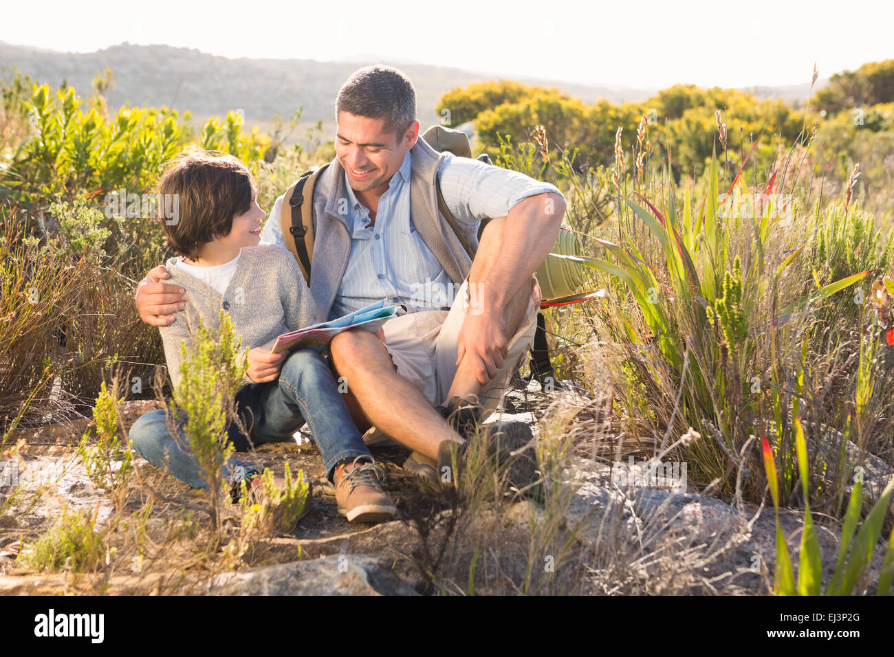 Father and son hiking in the mountains Stock Photo