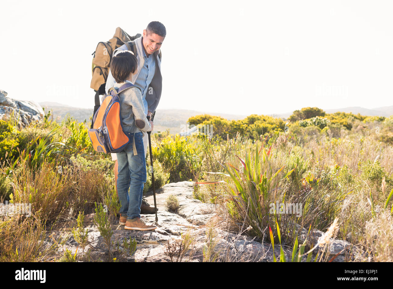 Father and son hiking in the mountains Stock Photo