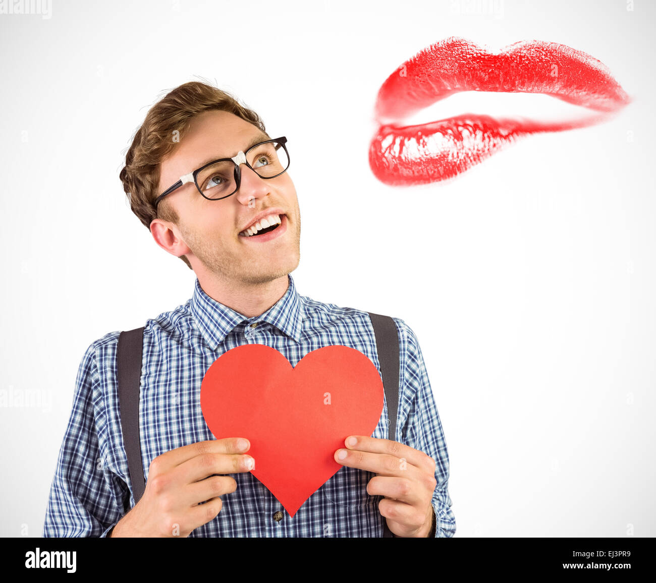 Composite image of geeky hipster holding a heart card Stock Photo