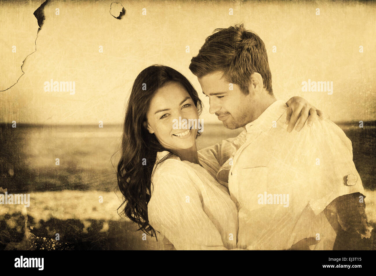Composite image of young couple embracing and posing on the beach Stock Photo