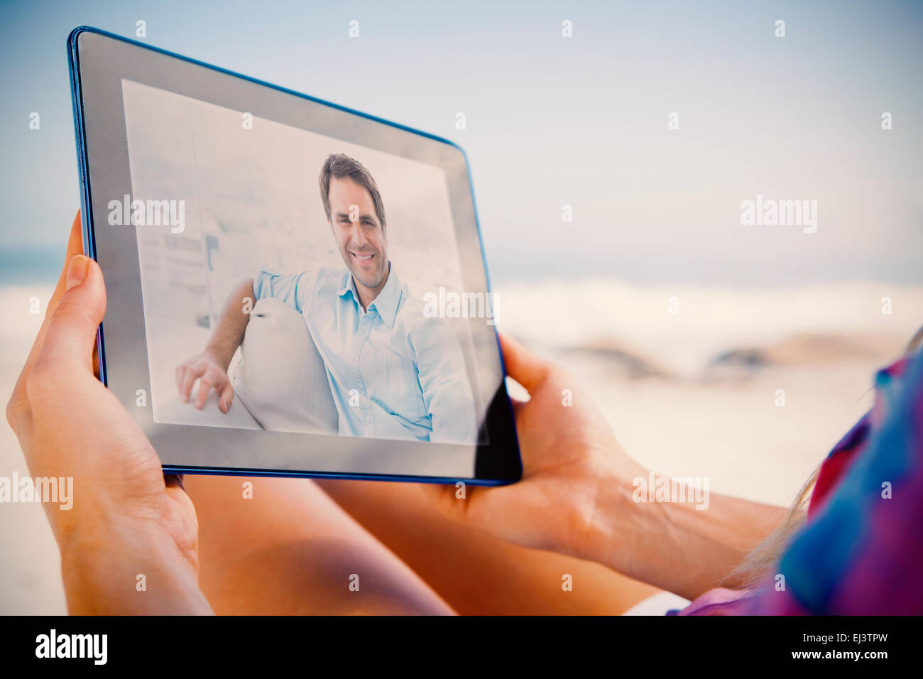 Man sitting couch smiling hi-res stock photography and images - Alamy