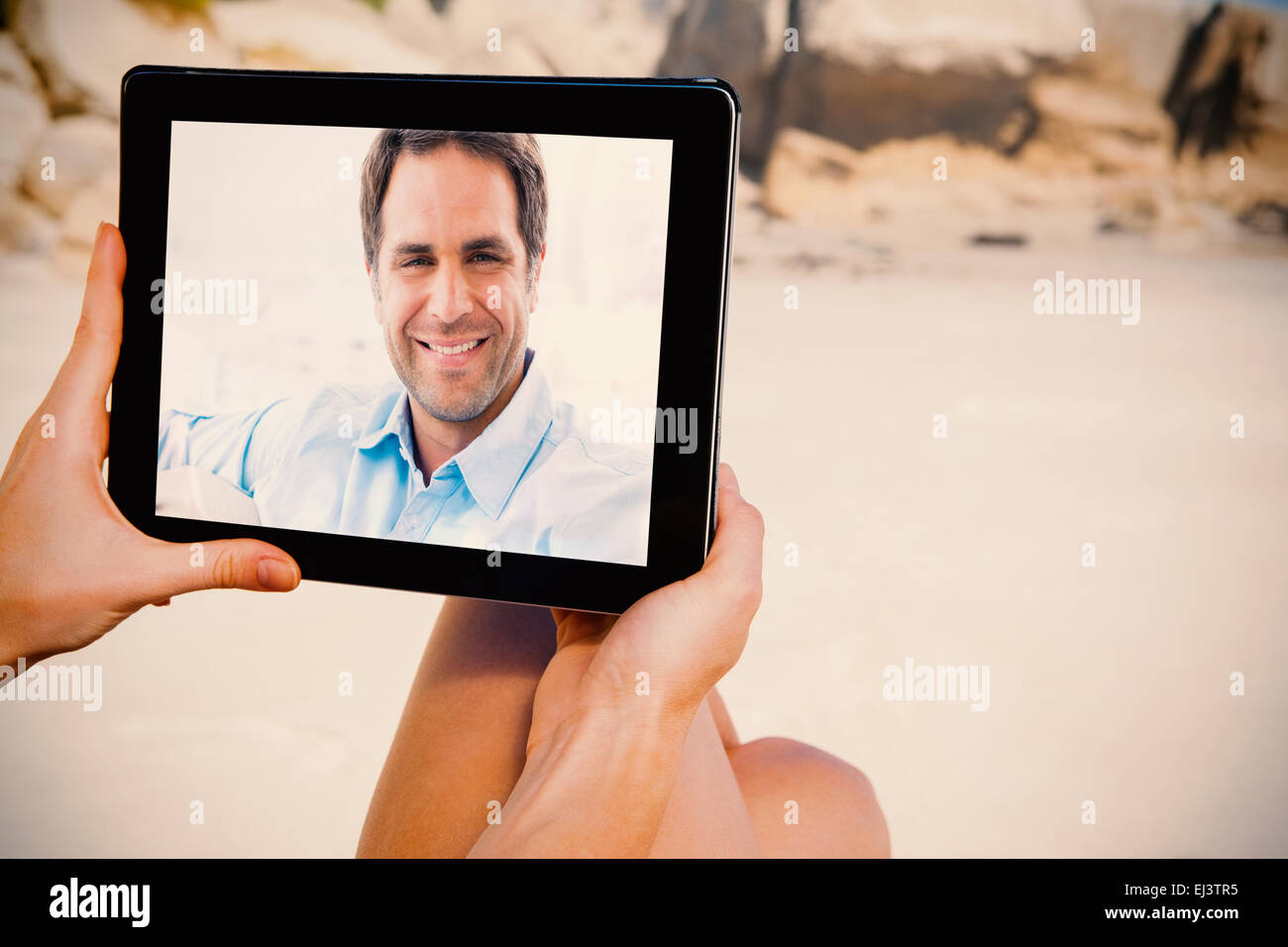 Man sitting couch smiling hi-res stock photography and images - Alamy