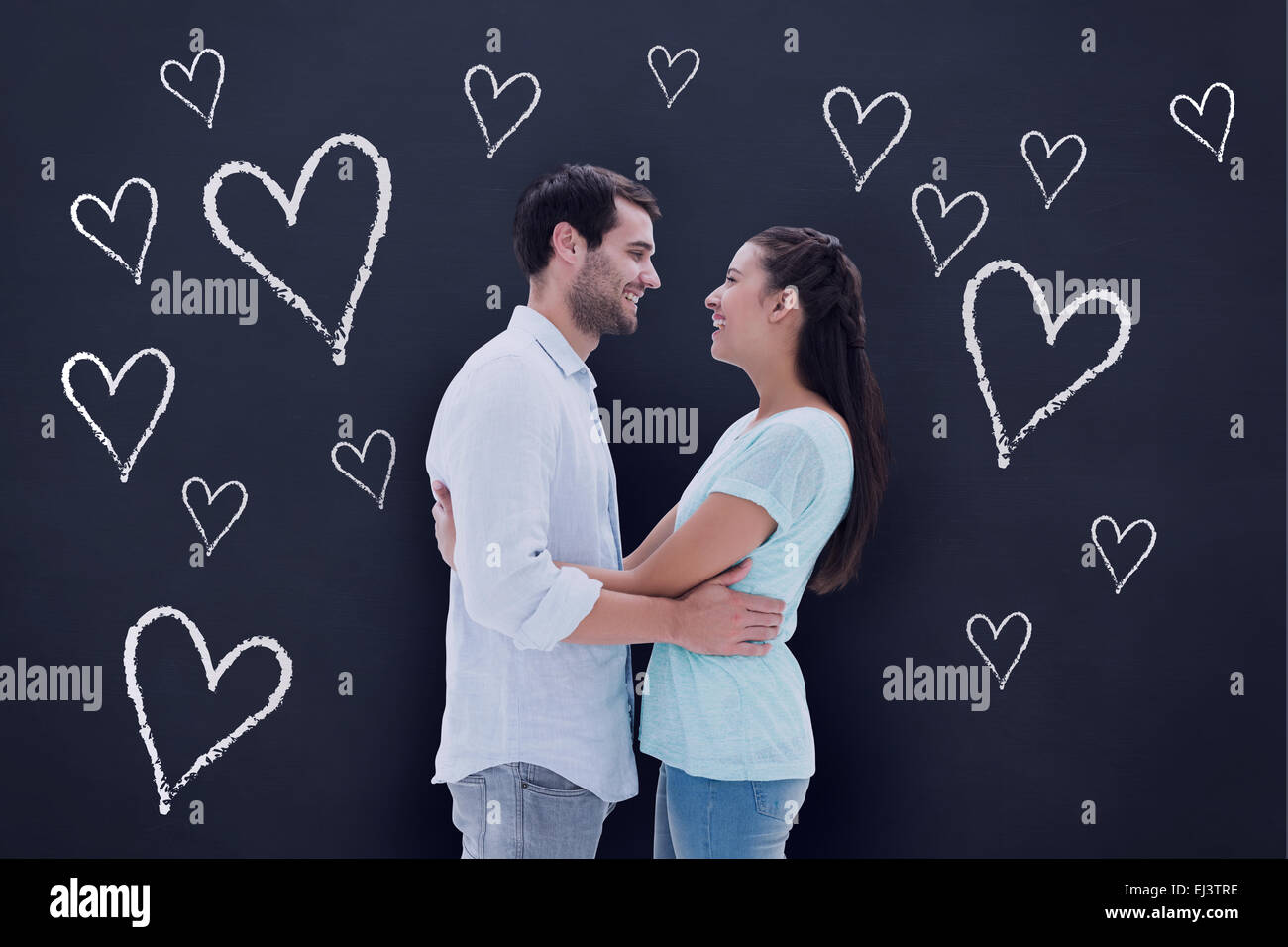 Composite image of attractive young couple hugging each other Stock ...