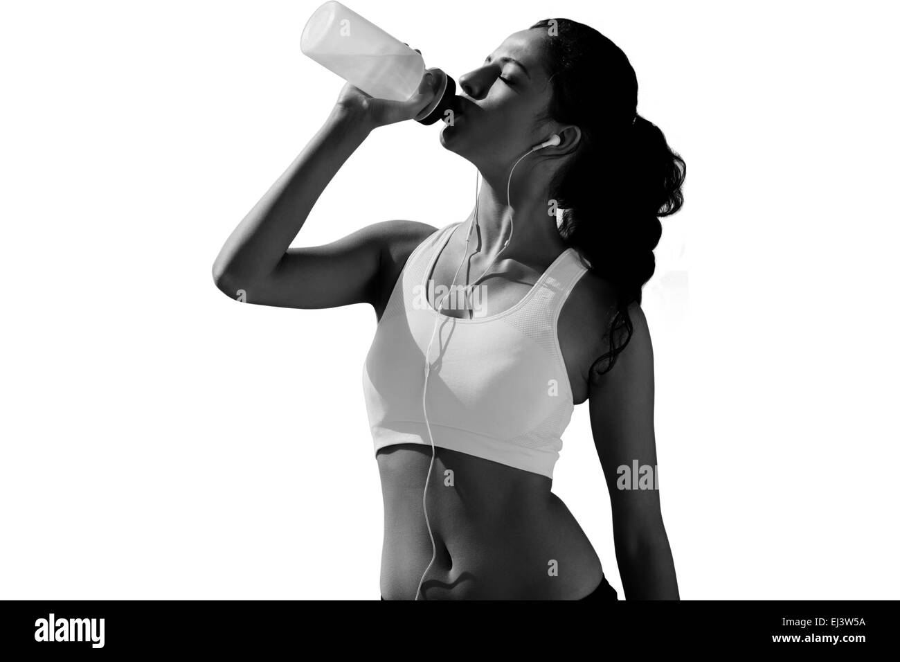 Composite image of beautiful healthy woman drinking water Stock Photo