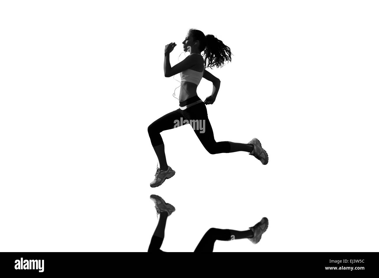 Composite image of full length of healthy woman jogging Stock Photo