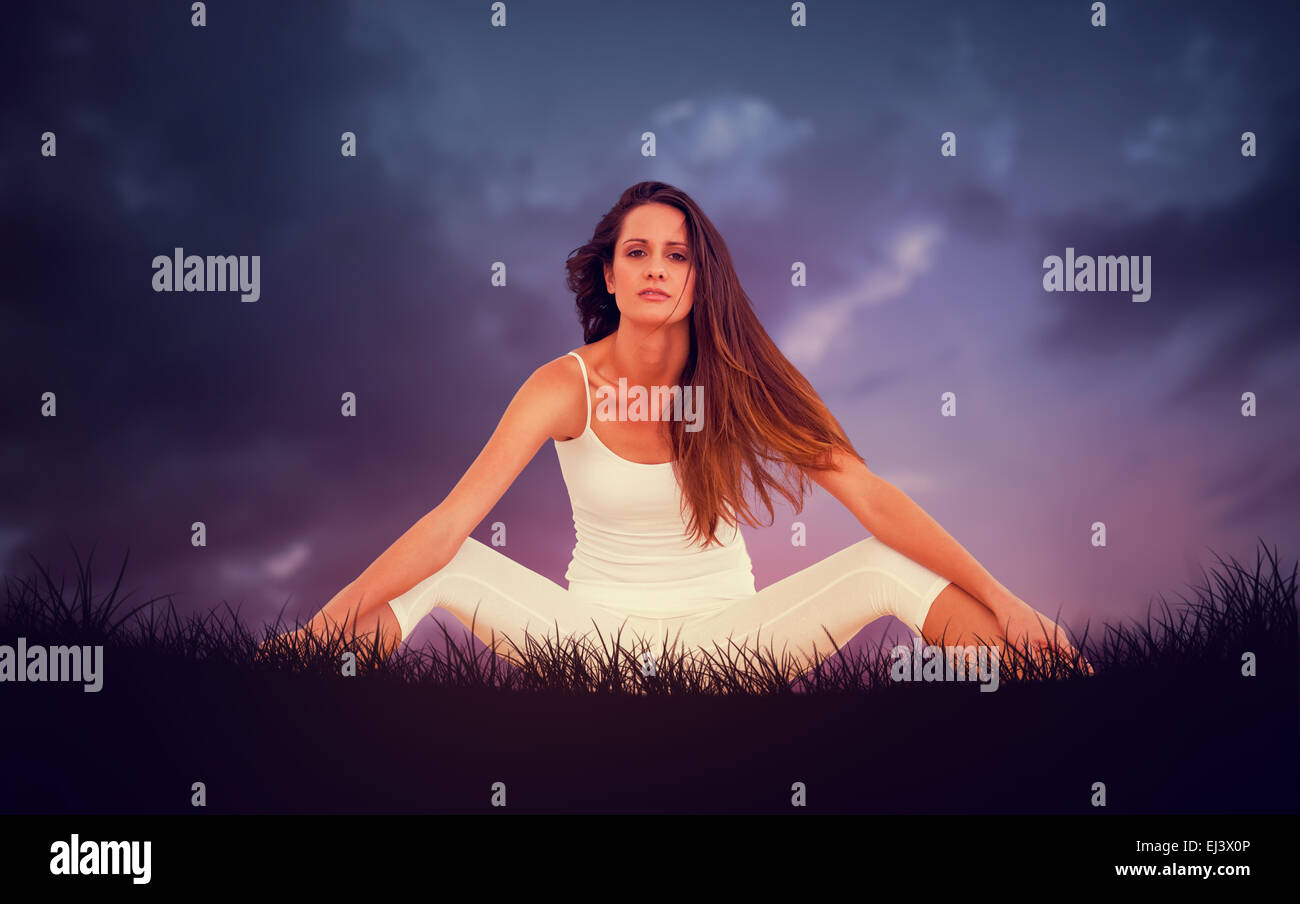 Composite image of slim woman with long hair in fitness studio Stock Photo