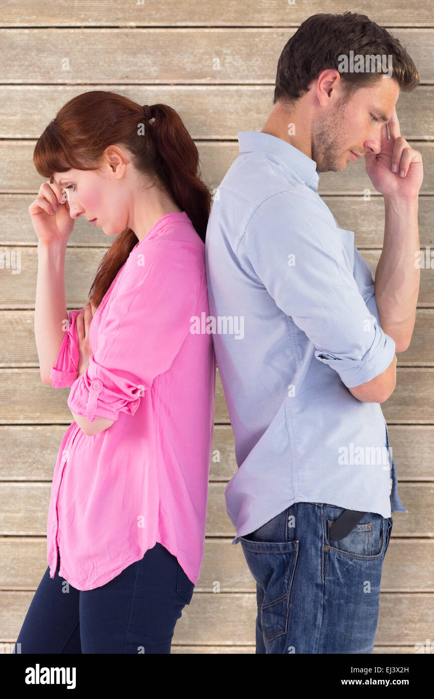 Composite image of irritated couple ignoring each other Stock Photo