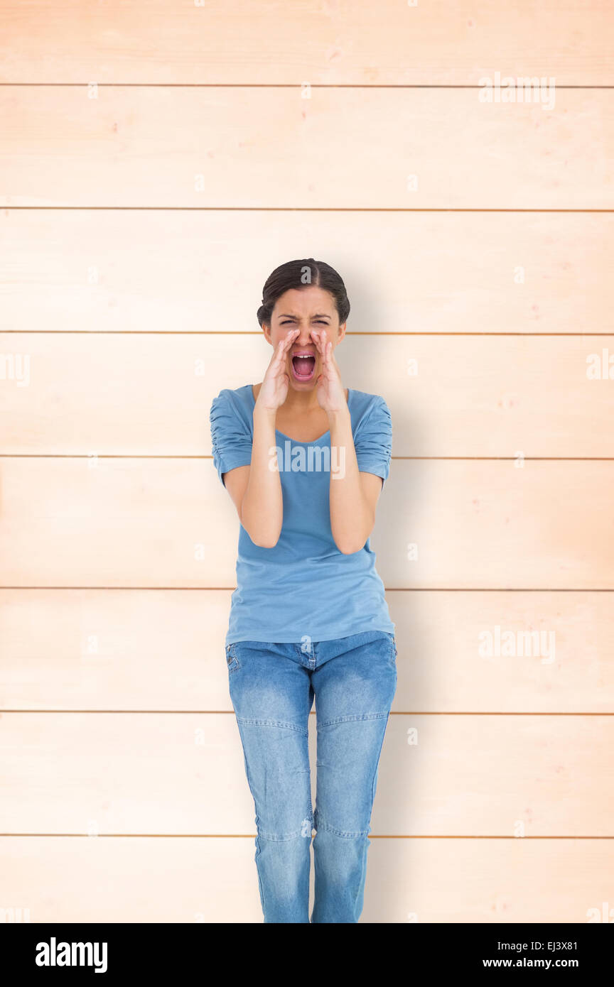 Composite image of pretty brunette shouting Stock Photo
