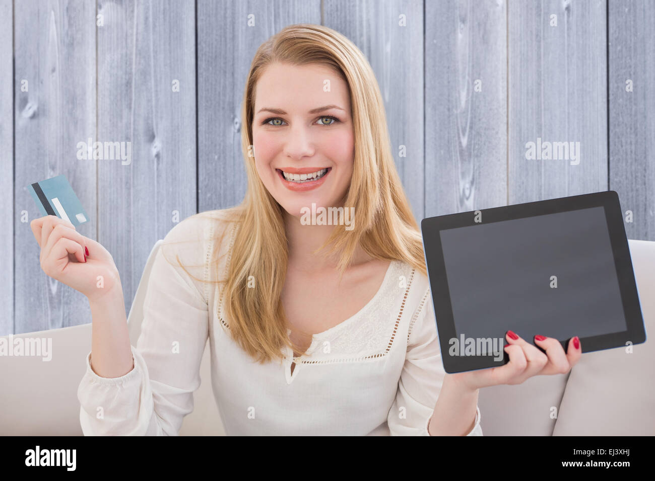 Composite image of blonde shopping online Stock Photo
