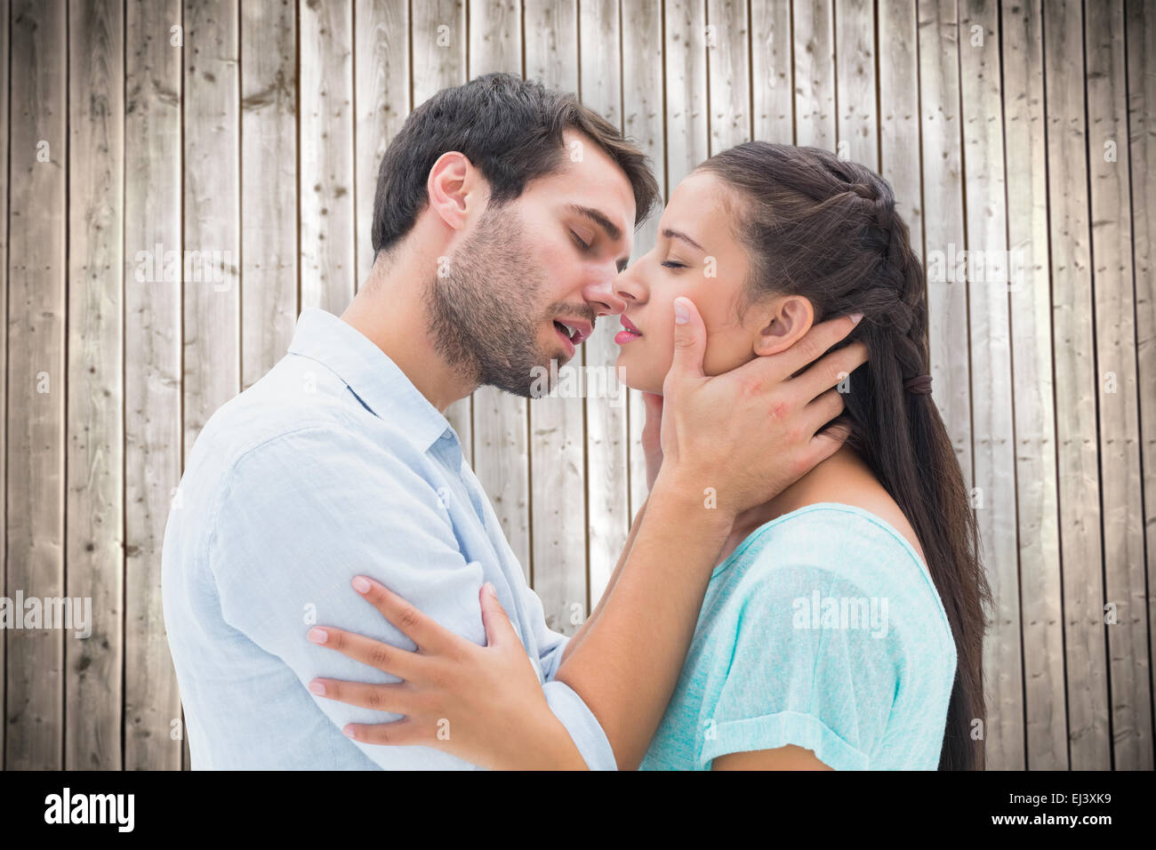 Composite image of attractive young couple about to kiss Stock Photo
