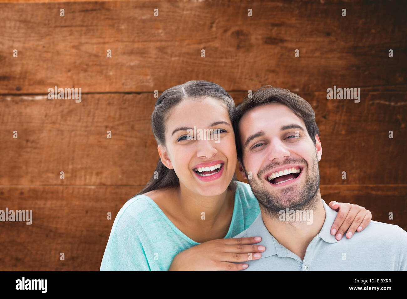 Composite image of cute couple smiling at camera Stock Photo